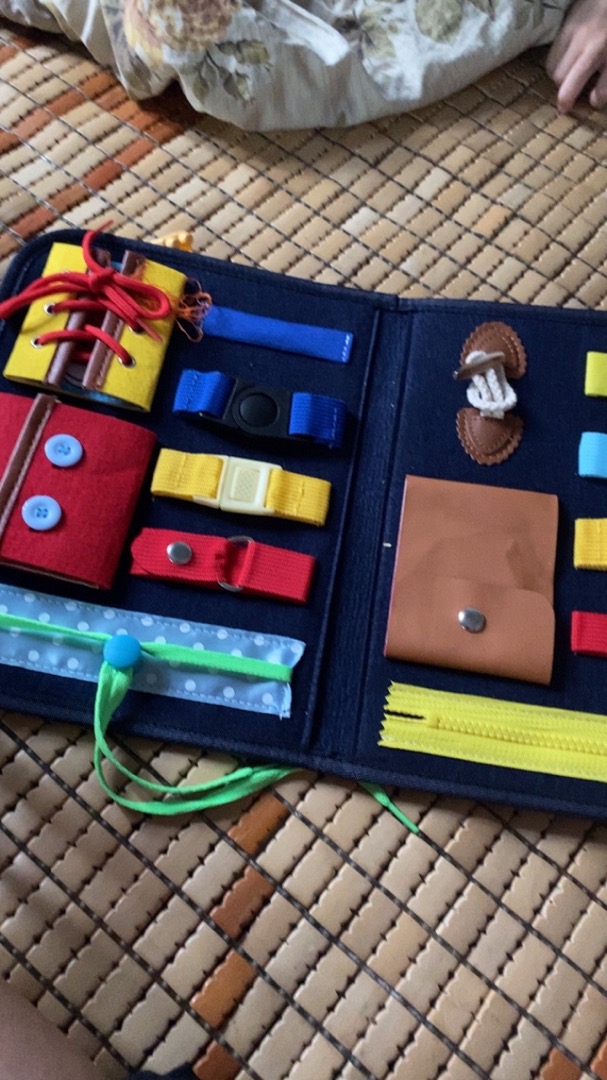 Busy board in the shape of a toy bag to practice skills for babies photo review