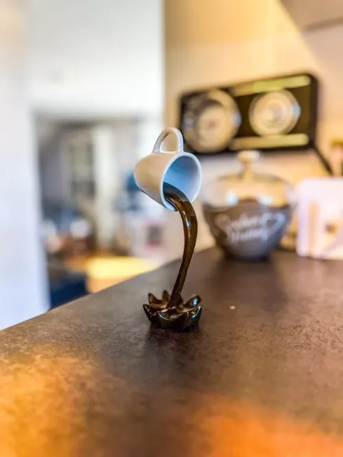 Floating Spilling Coffee Cup Sculpture For Kitchen Decoration photo review